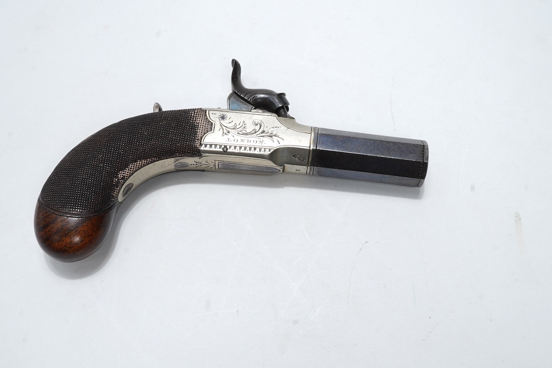 A pair of boxlock percussion pocket pistols with 4cm octagonal barrels, the frames engraved Lacy & Co., London, with London proof marks and rounded chequered walnut butts (2)